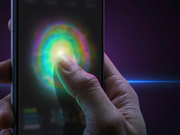 sportsbet.io + Finger touching a glowing circle on a phone screen